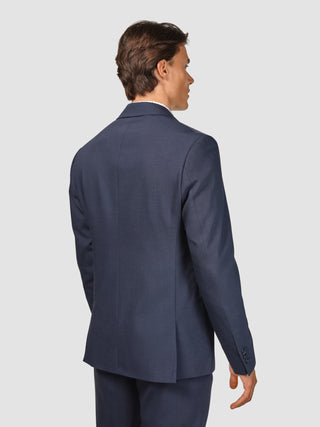 En man sedd bakifrån, klädd i en Tech Wool Suit Navy-kavaj.