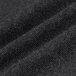 Närbild på mörkgråa byxor i bruten twill från Atelier Pants Relaxed Dark Grey, i ett tyg med strukturerat stickmönster.