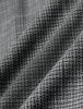 Närbild på byxorna Women Nara Pants Wide Black Check, tillverkade i ett svart tyg med 360°-stretch och ett vitt rutmönster i mjuka veck.