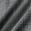 Närbild på byxorna Women Nara Pants Wide Black Check, tillverkade i ett svart tyg med 360°-stretch och ett vitt rutmönster i mjuka veck.
