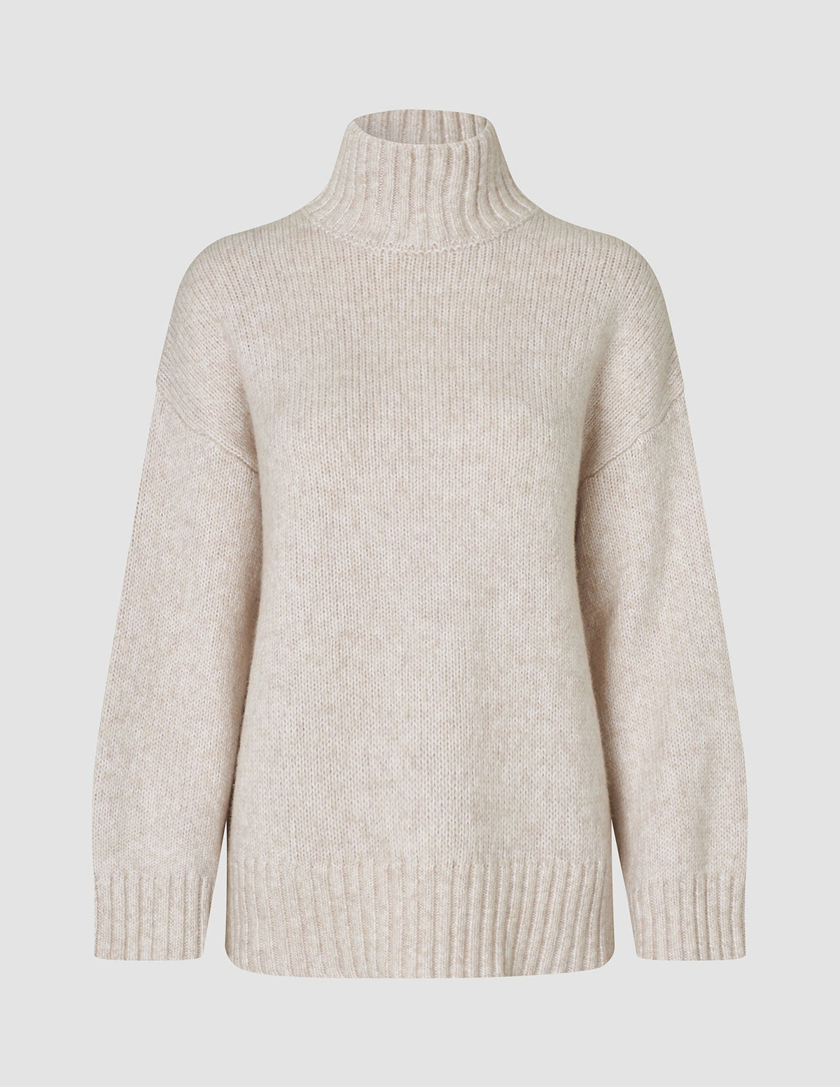 Beige damtröja i tjock, mjuk ull med hög hals, modell Sugar Melange, i merinoull med ribbad kant.