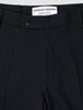 Närbild på marinblå Motion Suit-byxor i normal passform (Regular) i färgen Midnight Blue med 360°-stretch, knäppning och märkesetikett på insidan.
