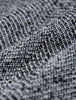 Närbild på byxorna Women Ashryn Pants Wide Domino Herringbone med ett svartvitt, strukturerat fiskbensmönster.