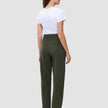 En kvinna sedd bakifrån, klädd i en vit t-shirt och raka byxor av modellen Women GO2 Pants Straight i färgen Dusty Olive.