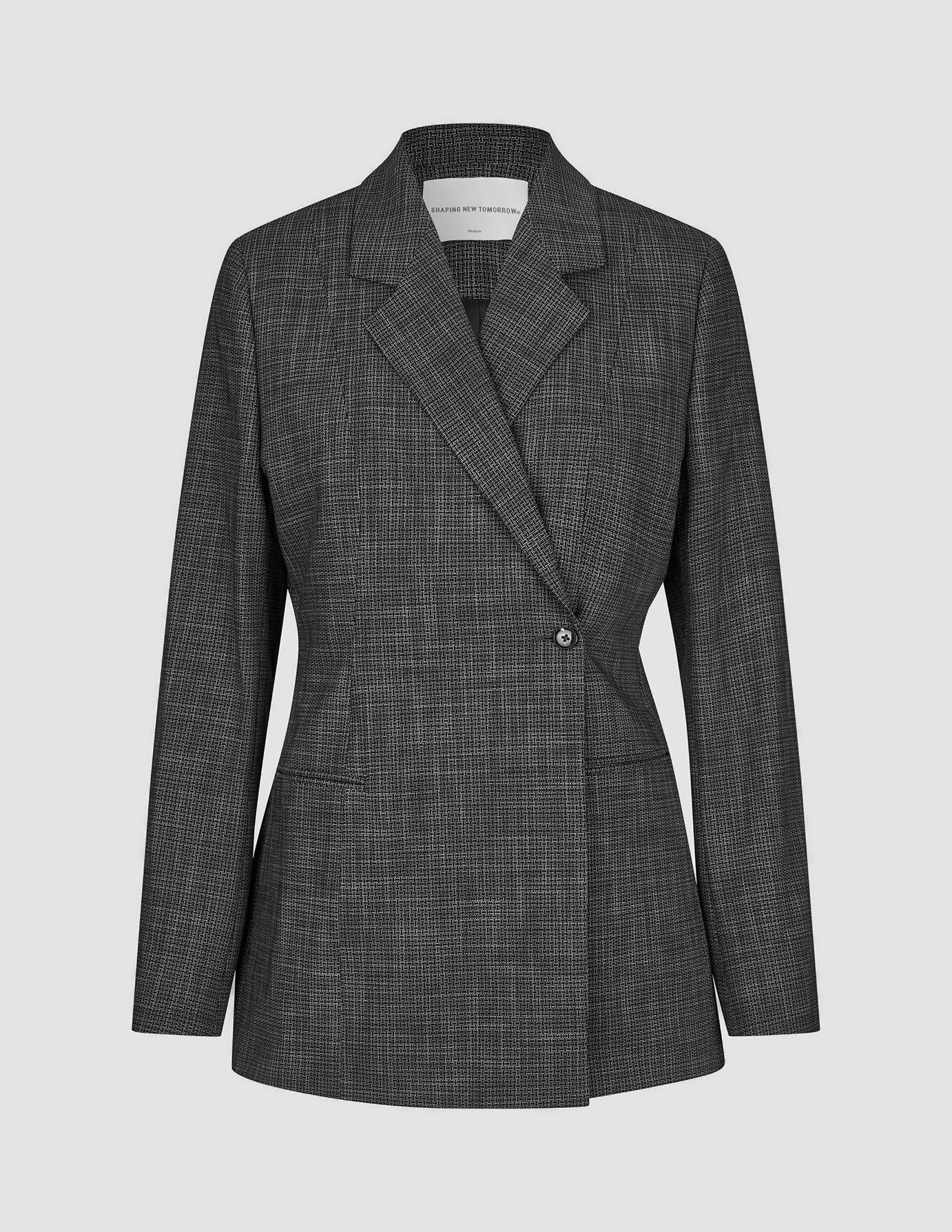 Nara-kavaj för damer, figursydd, svart rutig med ett diskret grått mönster och en knapp.